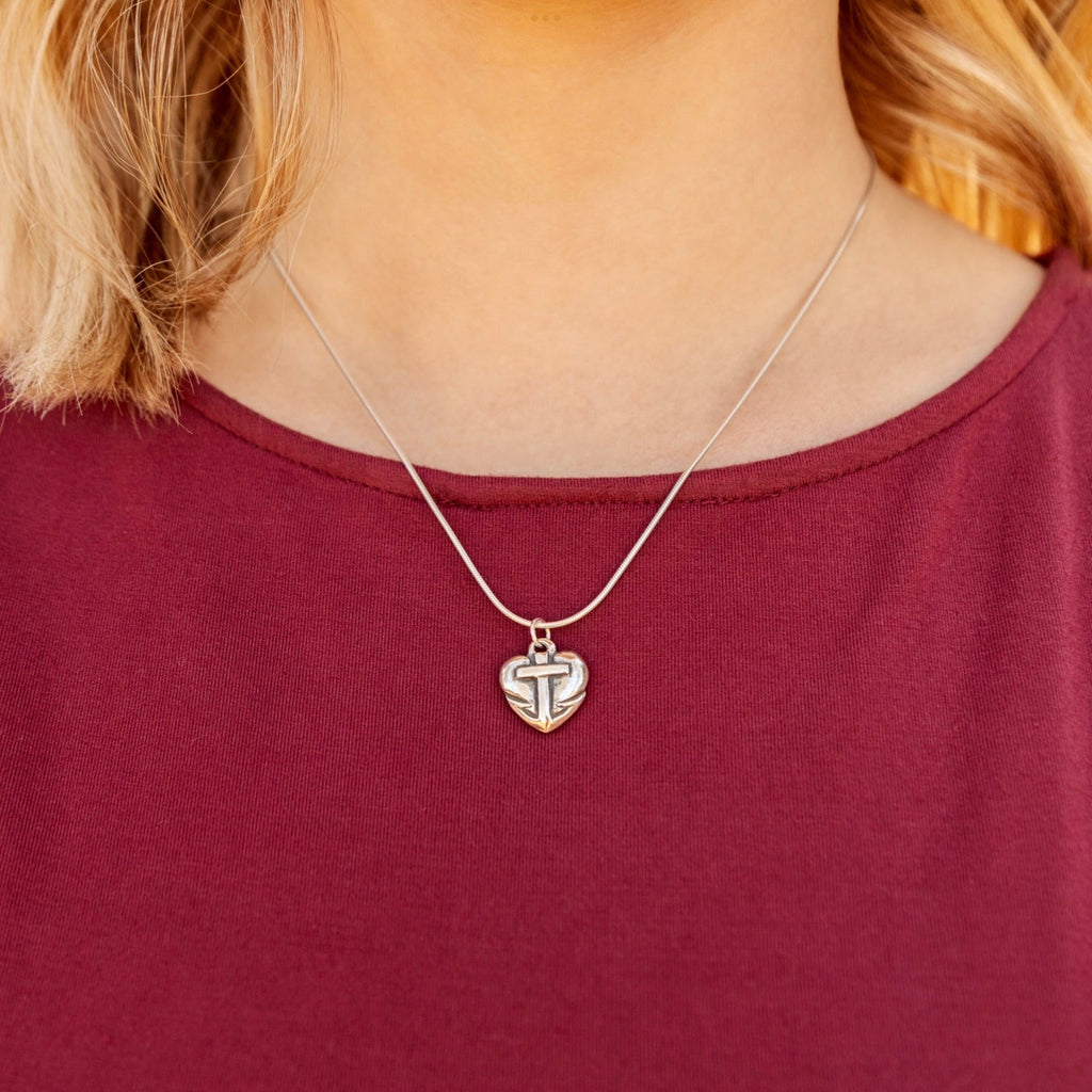 faith hope love pendant worn close on necklace
