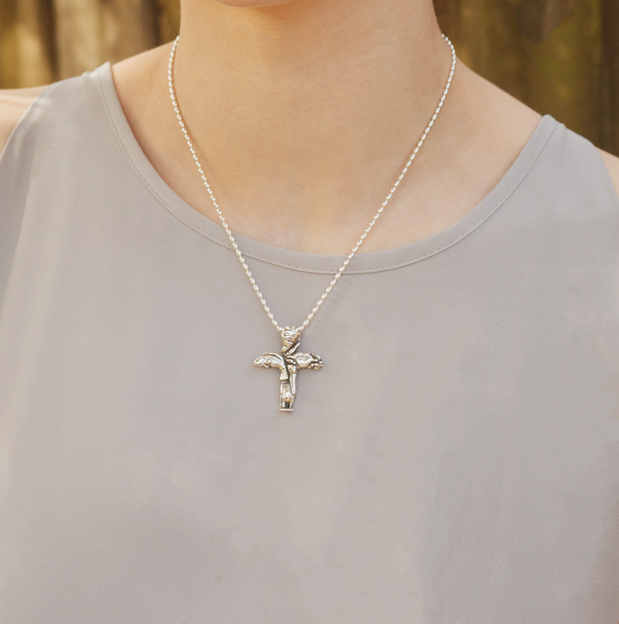 Sterling silver Gulf Coast cross necklace worn on model