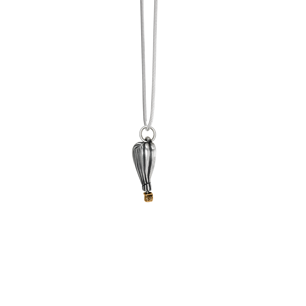 Side profile of sterling silver heart hot air balloon pendant with bronze basket