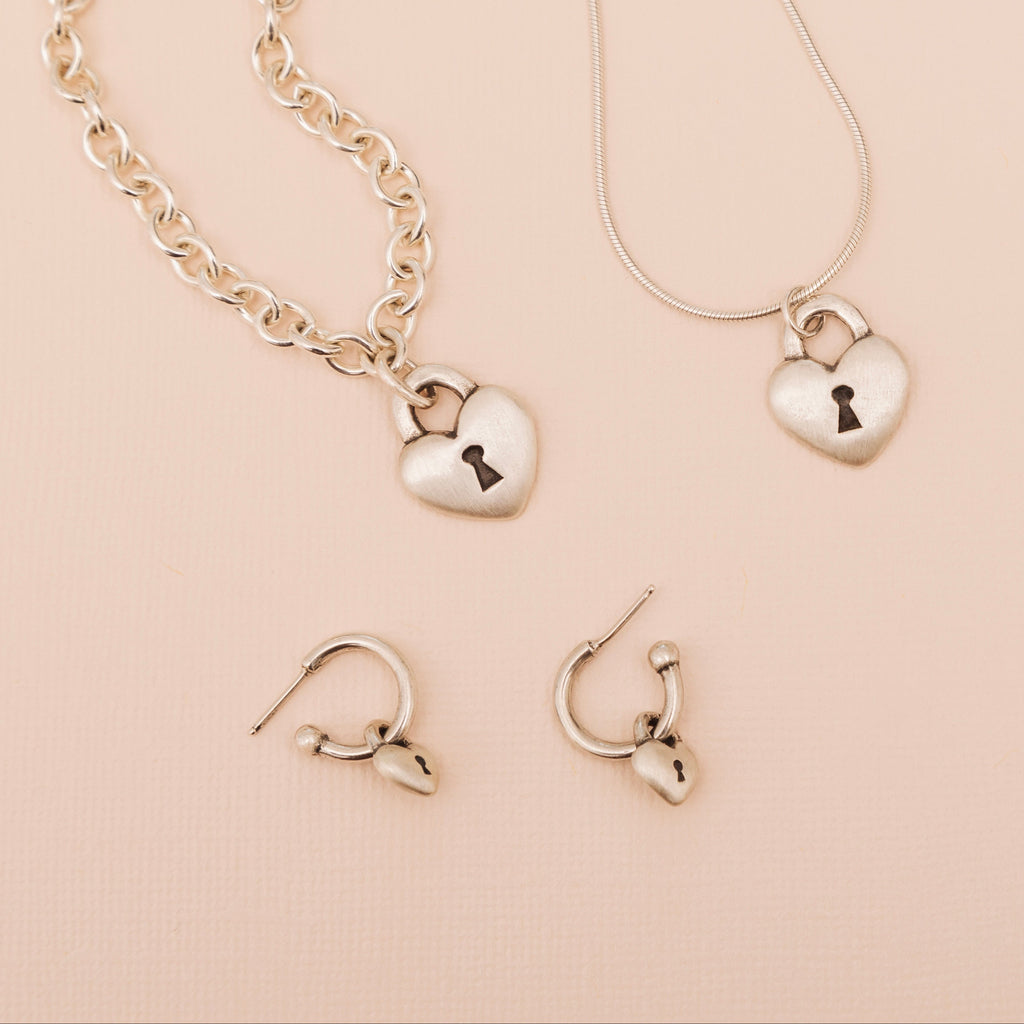 Love Lock heart hoop earrings shown with matching sterling silver Love Lock necklace and pendant