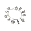Silver charm bracelet with various charms on a white background