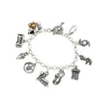 A sterling silver charm bracelet featuring a variety of hand-carved charms that represent New Orleans icons and culture, such as a king cake baby, a Mardi Gras mask, and beignets with coffee.