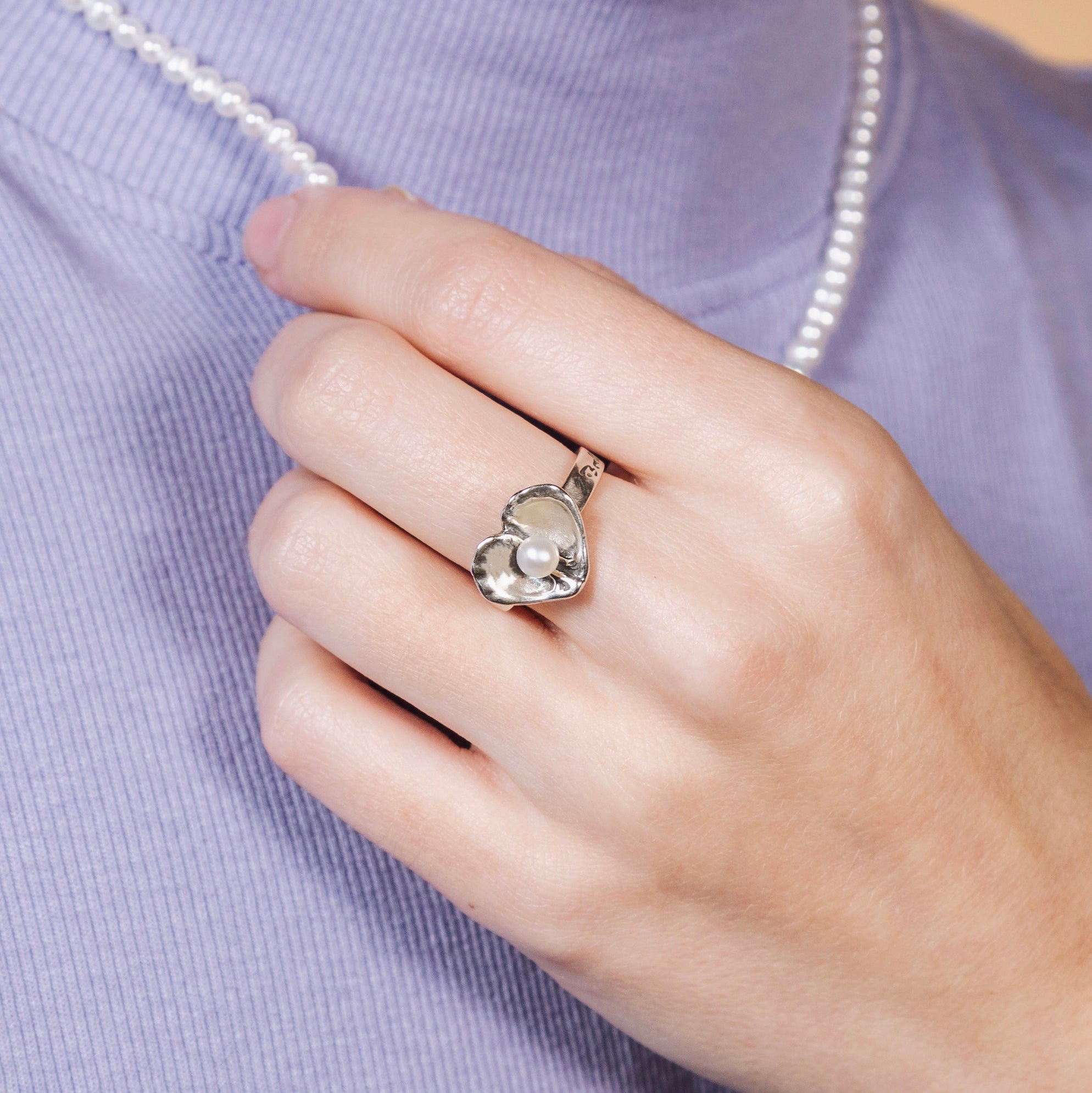 woman wearing oyster heart pearl ring — sterling silver everyday ring