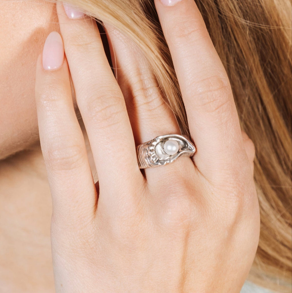 large oyster pearl statement ring worn on hand showing bold size and sculptural detail
