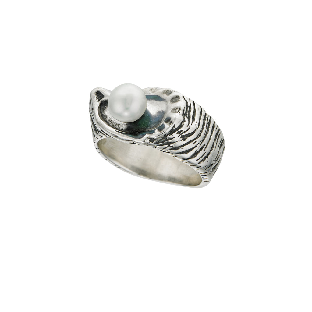 side view of large oyster pearl ring highlighting carved shell texture and elevated pearl