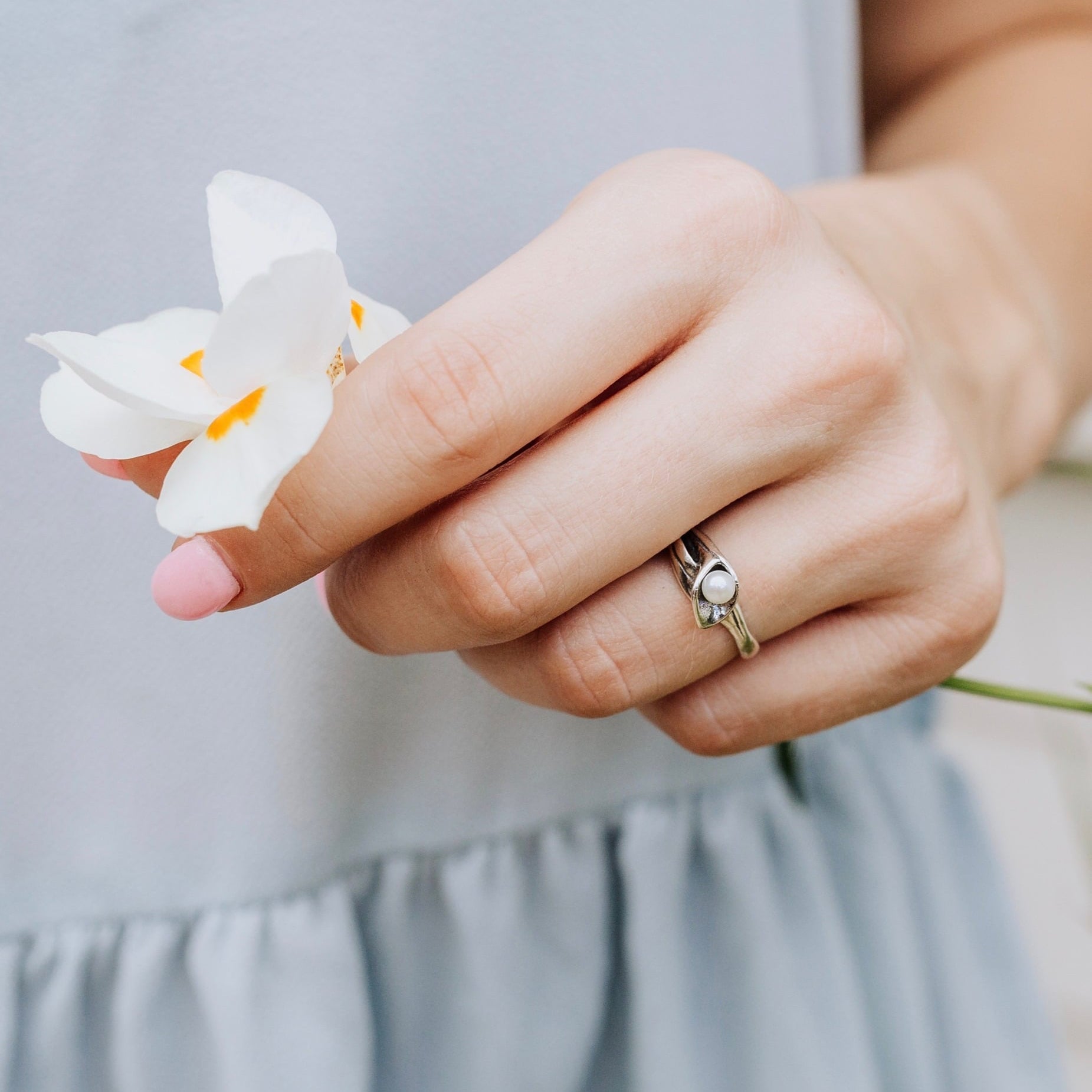 Calla lily pearl ring handcrafted in sterling silver worn by model