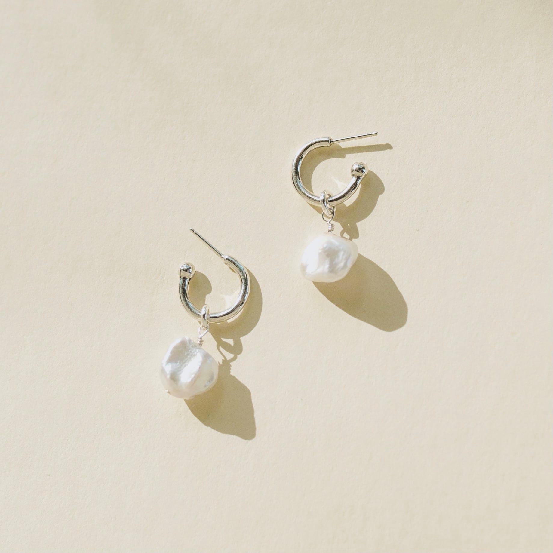 pearl hoop earrings worn close showing pearl detail