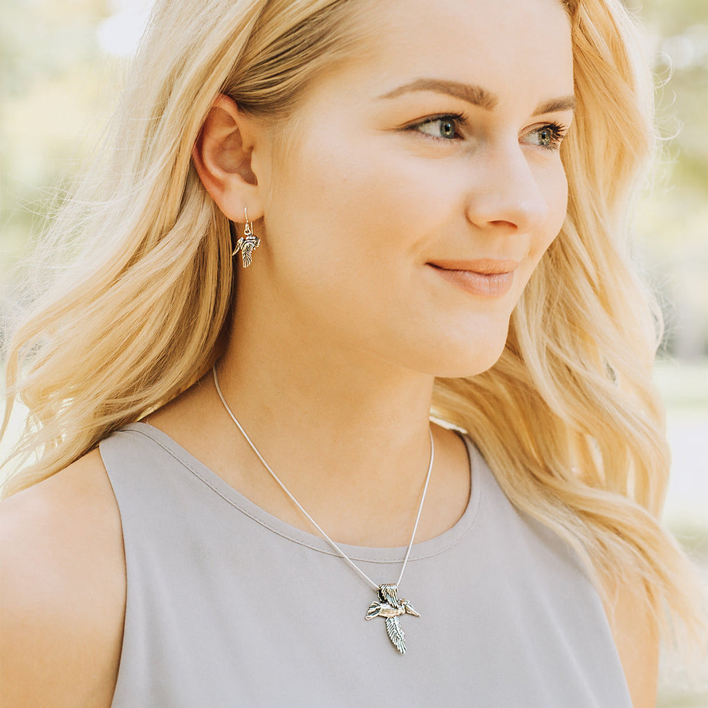 sterling silver pelican earrings paired with pelican cross necklace, handcrafted new orleans jewelry set