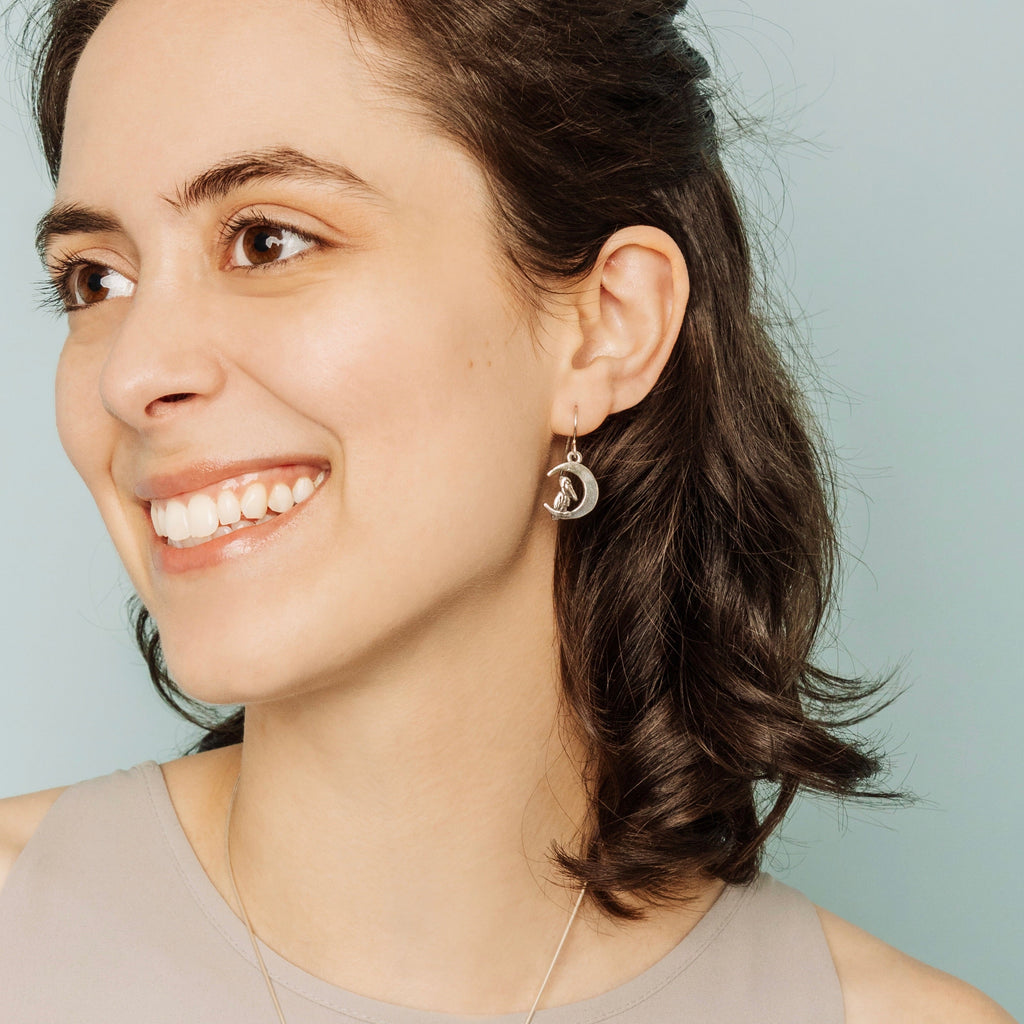 sterling silver pelican moon earrings worn by model, unique crescent moon jewelry from new orleans