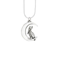 terling silver pelican moon pendant with pelican resting on crescent moon, handcrafted new orleans jewelry
