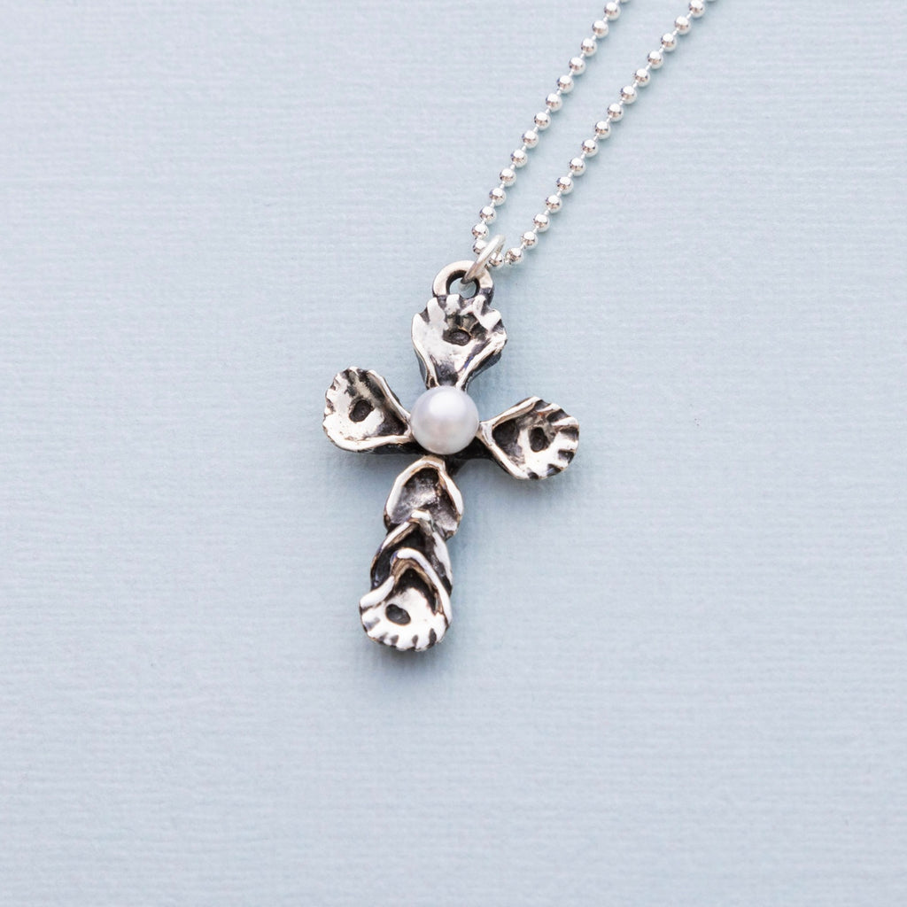 Sterling silver oyster pearl cross pendant with freshwater pearl designed by Jose Balli